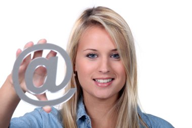 Girl holding @ sign clipart