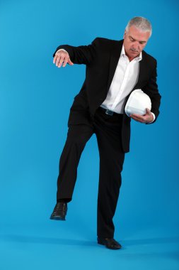 Businessman balancing on one leg clipart