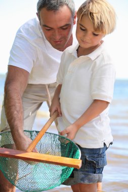 Father and son fishing clipart