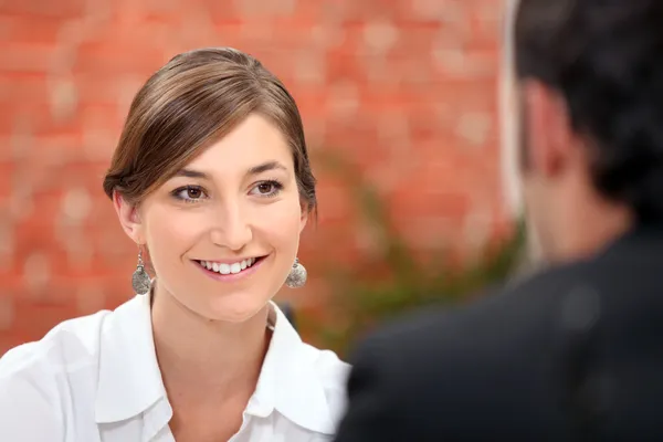 Woman smiling at her date — Stock Photo, Image