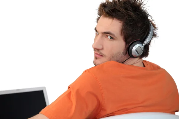 An angry man listening to music — Stock Photo, Image