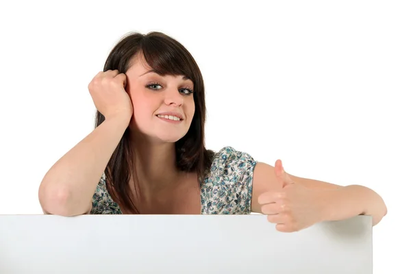 Thumbs up from a young woman — Stock Photo, Image