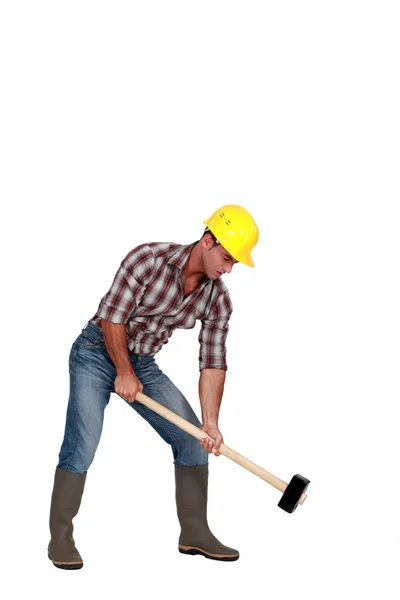 Labourer using a mallet — Stock Photo, Image