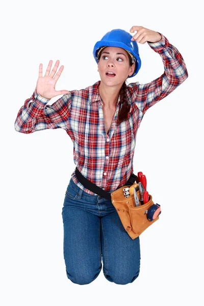 A female construction worker trapped in an invisible box. — Stock Photo, Image