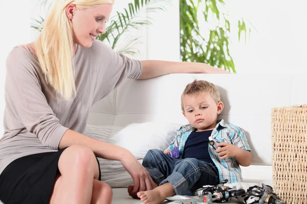 Woman sitting with a little boy — Stock Photo, Image