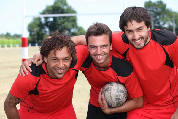 Drie voetbal teamgenoten — Stockfoto