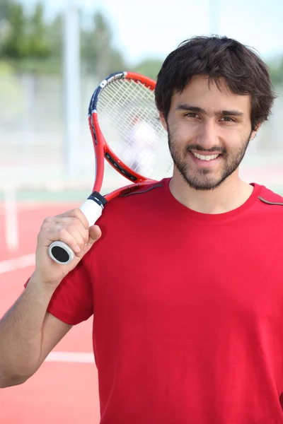 Теннисист держит ракетку — стоковое фото