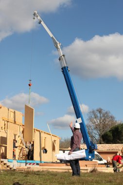 Crane on work site clipart