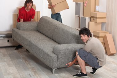 Picture of friends moving a couch clipart