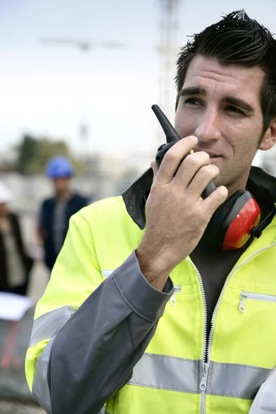 Foreman with a walkie talkie — Stock Photo, Image