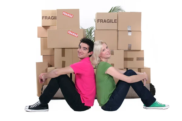 Young and cardboard boxes — Stock Photo, Image
