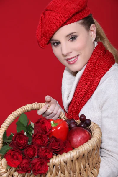 Red themed woman with basket — Stock Photo, Image