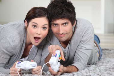 Couple playing a video game clipart
