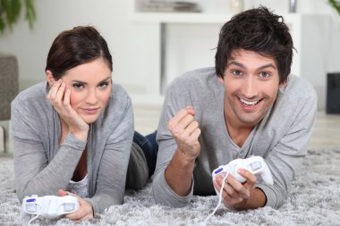 Couple playing a games console clipart