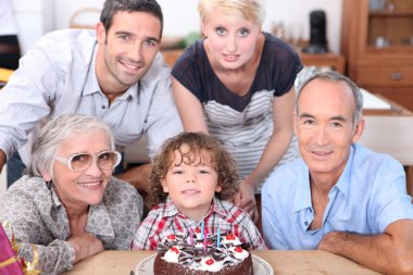 Family celebrating a birthday together clipart