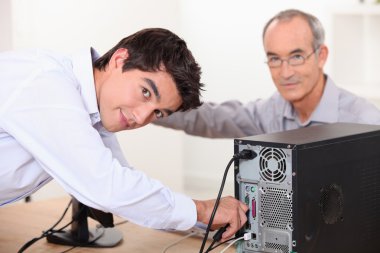 Technician repairing computer clipart