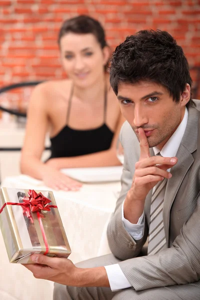 Man with a surprise present — Stock Photo, Image