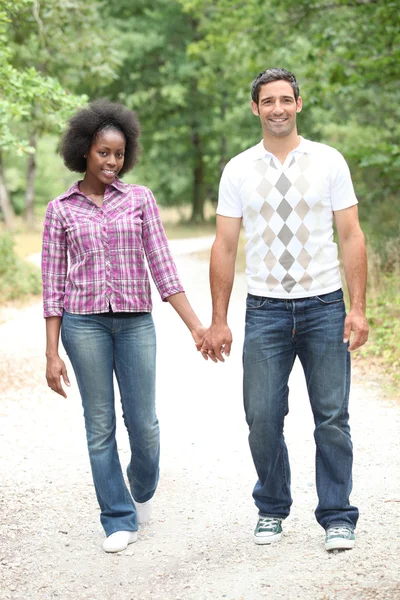 Couple walking in the woods — Stock Photo, Image