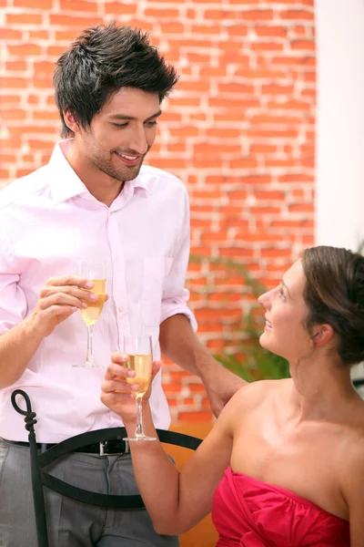 Couple drinking champagne in a restaurant — Stock Photo, Image