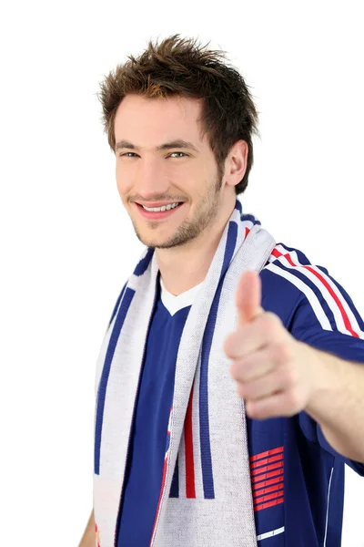 Fan piłki nożnej Dokonywanie kciuki znak — Zdjęcie stockowe