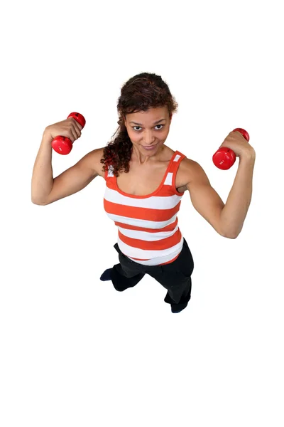 Woman doing exercises with a dumbbell — Stock Photo, Image
