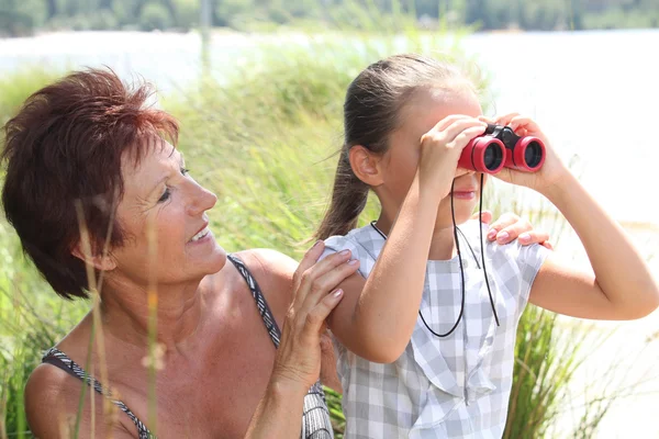 Little girl with pair of binoculars — Stock Photo, Image