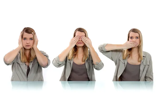 Woman covering her eyes, ears and mouth with her hands — Stock Photo, Image
