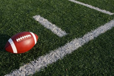 Football near the yard lines clipart