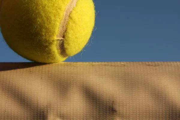 Tennis Ball close up on Net — Stock Photo, Image