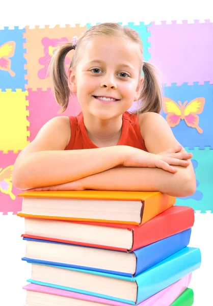 Smiling little schoolgirl with the books — Stock Photo, Image