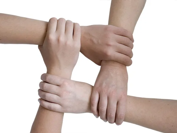 Объединённые руки над белыми — стоковое фото