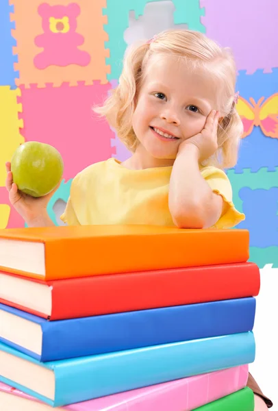 Smiling little schoolgirl with the books — Stock Photo, Image