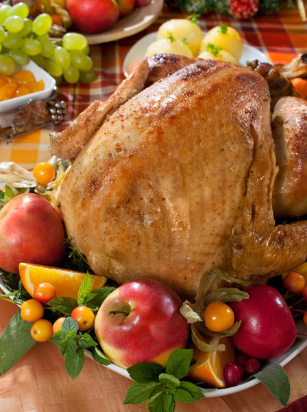 Roasted turkey on holiday decorated table