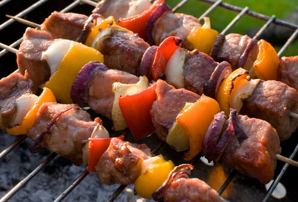 Kabobs grilled with vegetables on skewers — Stock Photo, Image