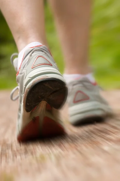 Stock image Woman jogging on parkway path