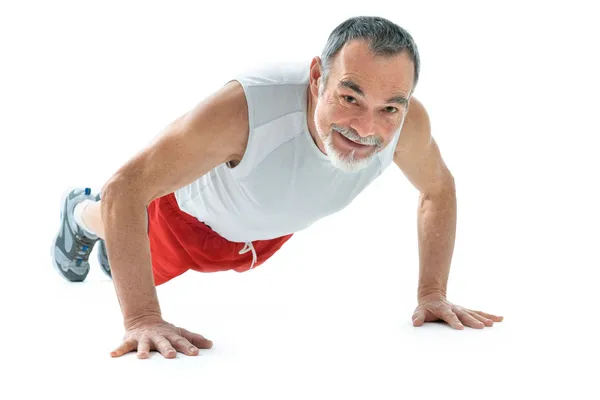 Senior man doing push-ups — Stock Photo, Image