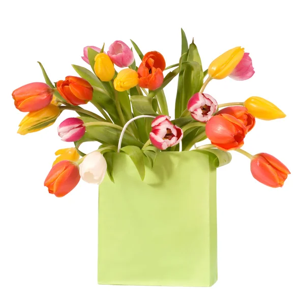 Bouquet of tulips in shopping bag — Stock Photo, Image