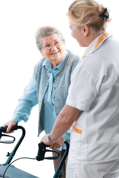 Trabajador sanitario y paciente de edad avanzada — Foto de Stock
