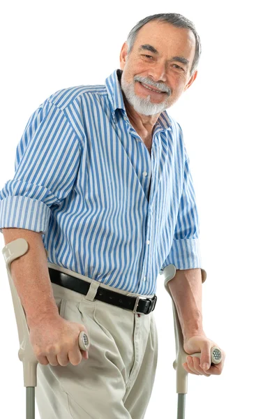 Homem idoso com muletas — Fotografia de Stock