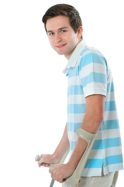 Young man on crutches — Stock Photo, Image