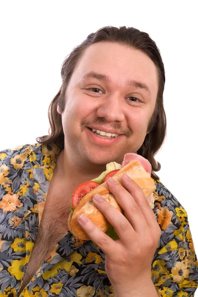L'uomo mangia un panino — Foto Stock