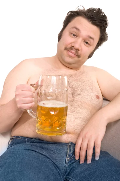 Överviktig man med en öl glas — Stockfoto