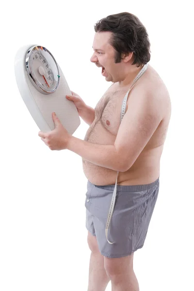 Overweight man with the weight scale — Stock Photo, Image