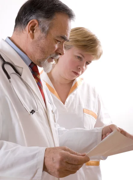 Two doctors looking at an EKG Stock Photo