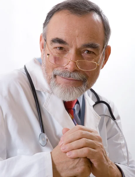 Caring doctor smiling Stock Image