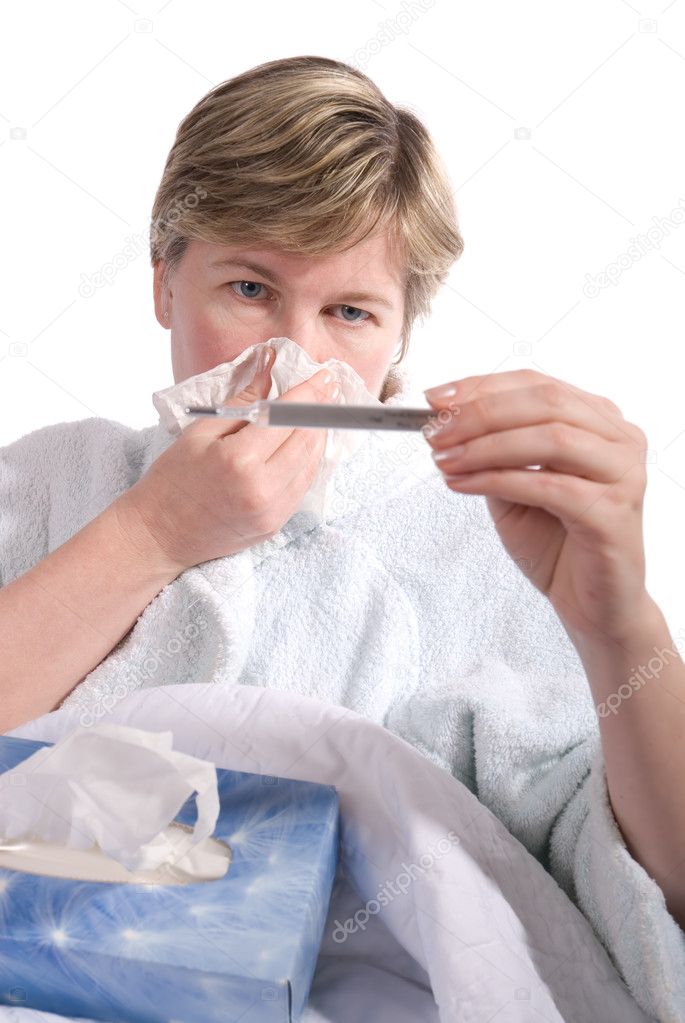 Woman with influenza checking her temperature