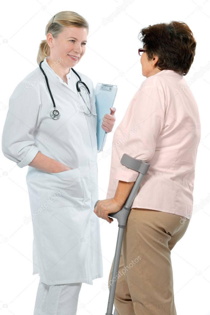 Doctor attending senior woman