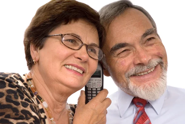 Casal recebendo boas notícias pelo telefone — Fotografia de Stock