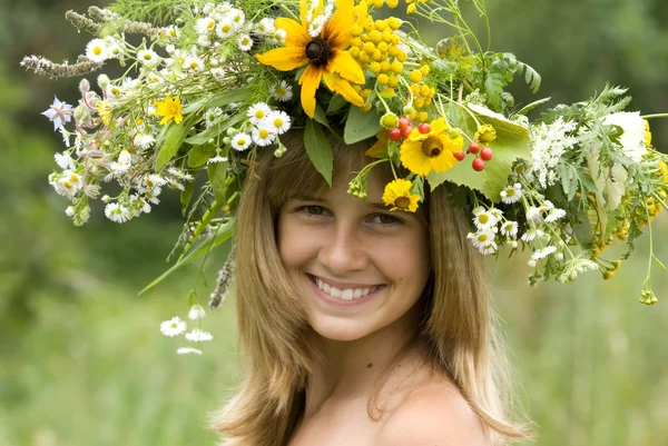 stock image Girl with flower wreath in the meadow