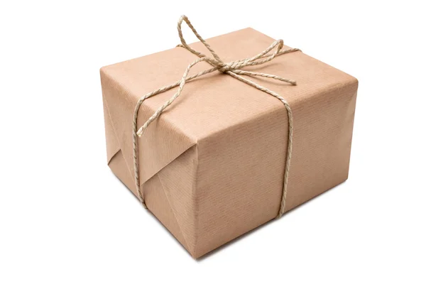 Parcel wrapped in brown packing paper — Stock Photo, Image